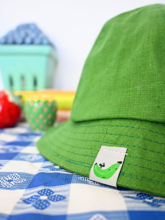 "Plantain & Ant" Linen bucket hat. Designed by HO HOS HOLE IN THE WALL brand. Made in NYC.